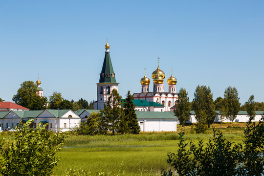 View of the Valday Iversky Monastery with the Assumption Cathedral and the bell tower from the side of Valdai Lake. Novgorod Region, Russia