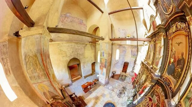 Prnjavor, Serbia, Sept 2,2024: 360 view through arched windows illuminates the frescoes on the walls and pillars inside the Ljubostinja monastery church in Serbia