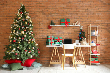 Interior of office with workplace, presents and Christmas trees