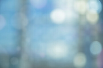 The background is blurred in blue tones. Defocus.