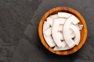 Cocos nucifera - Fresh grated coconut in the bowl.