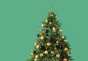 Beautiful Christmas tree on green background, closeup