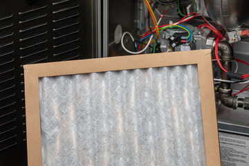 New furnace filter. HVAC maintenance, indoor pollen allergy and duct cleaning concept.