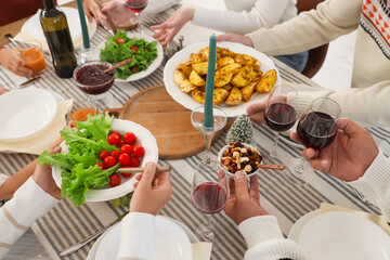 Big family having Christmas dinner in kitchen, closeup