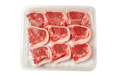 Nine fresh lamb loin chops on a plastic tray. High quality meat product on the bone cut by butcher in perfect size for cooking. Food supply chain and agriculture industry. White background.