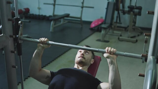 man working out in gym, man doing barbell bench press in gym, Exercises and chest muscle building