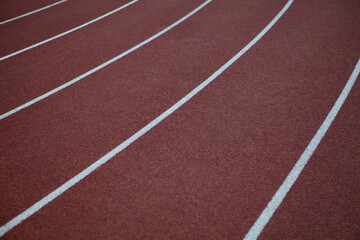 Red rubber track and field lines, lanes background texture