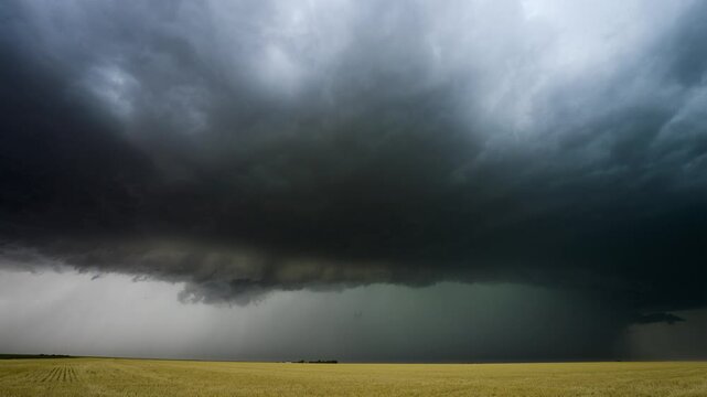 Powerful bolt of lightning strikes below huge severe thunderstorm