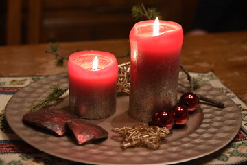 Red candles on Christmas evening