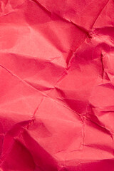 heavily crumpled red paper as background