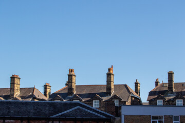 Traditional Brick Houses Under Clear Blue Sky