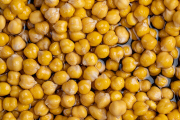 chickpeas porridge with honey during cooking