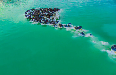 Lava rocks in the geothermal water of the Blue lagoon in Iceland