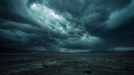 Dark, stormy clouds loom over a barren landscape, creating a dramatic and ominous scene.