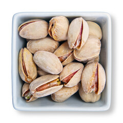 Pistachio nuts in shells in white container