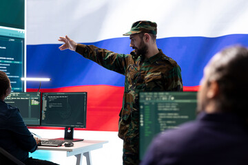 Russian army officer supervising cyber attacks on state networks, spreading misinformation and fake...