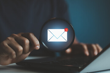 Email marketing concept, Business person sending email by a laptop computer to customer, business...