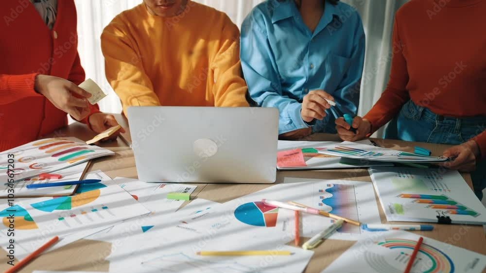 Poster startup company employee working together using laptop analyzing bi dashboard paper on financial dat