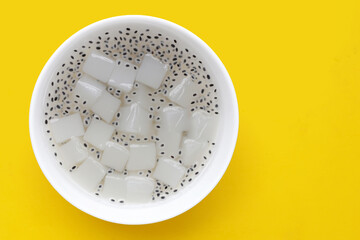 Coconut jelly with basil seeds in syrup