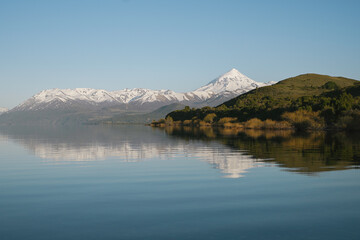 Majestic Volcano Lanin by Lake Huechulafquen on a sunny morning. Patagonia, Neuquen, Argentina
