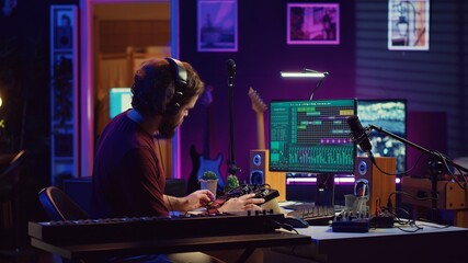 Musician recording electronic piano tunes and having fun in his home studio, editing and mixing...