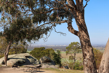 picnic ground in australian bushland in you yangs national park overlooking fields