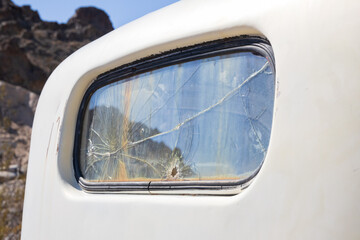 Cracked window pane of an old vehicle