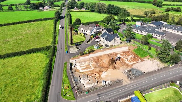 Aerial view of Residential homes, town houses, bungalows, housing, in Loughguile village Co Antrim Northern Ireland 