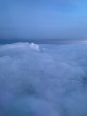 Fluffy Clouds from Airplane Window