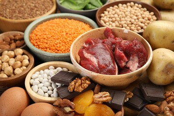Different products rich in iron on table, closeup