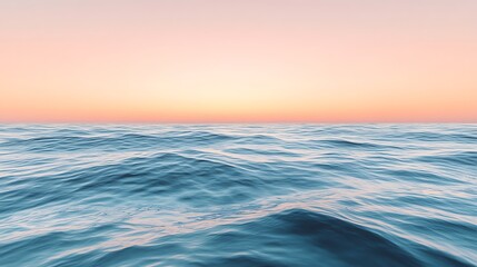 Obraz premium A calm sea with gentle waves and a pink sunset in the background.