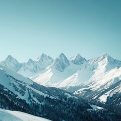 Obraz premium Majestic snow-capped mountains under clear blue sky a breathtaking winter landscape