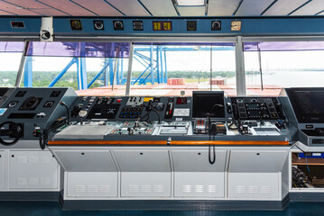 View of the control console on the navigational bridge of the cargo container ship. She is berthed in the port of Charleston, SC, USA. 