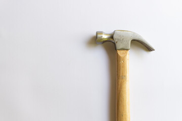Metal hammer and wooden handle with various layouts on a white background.
