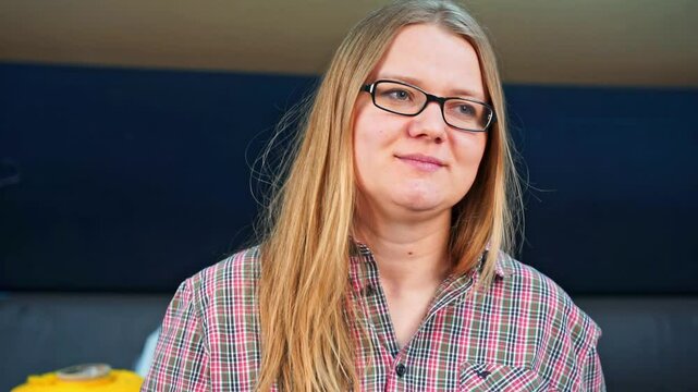 Female sales consultant fake smiles, shows ok hand gesture, fake emotions of friendliness nods head Corporate ethics end of shift feigned approval Hypocritical girlfriend reaction to clothes, purchase