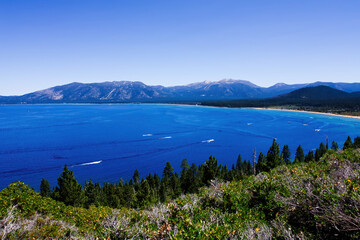 Boats On Lake Tahoe With Mountains And Blue Sky