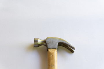 Metal hammer and wooden handle with various layouts on a white background.