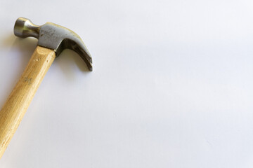Metal hammer and wooden handle with various layouts on a white background.