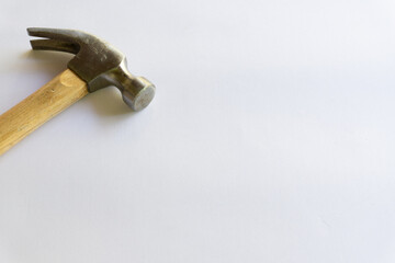 Metal hammer and wooden handle with various layouts on a white background.