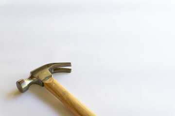 Metal hammer and wooden handle with various layouts on a white background.