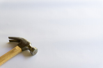 Metal hammer and wooden handle with various layouts on a white background.