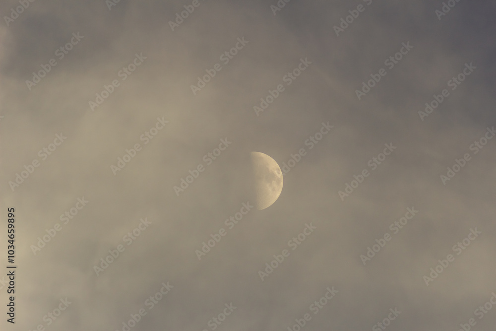 Wall mural moon in the blue sky with white clouds, closeup of photo