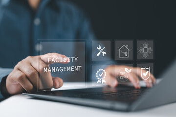 Facility management concept. Building resource management covers activities related to buildings or various locations. Businessman using laptop with facility management icon on virtual screen.