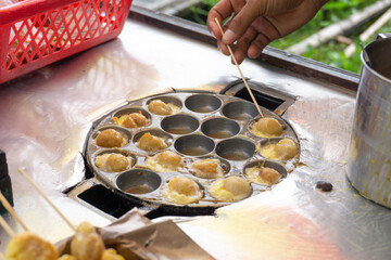 Selective focus Cilor Tusuk or Pentol Telur Gulung is a typical Indonesian snack. Usually Sell as Satay at Street Food.