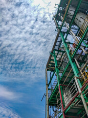 chemical factory, industrial plant. low-angle view with cloud and sky on background