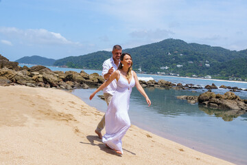 man and woman, couple, dressed in white, celebrating together, new year