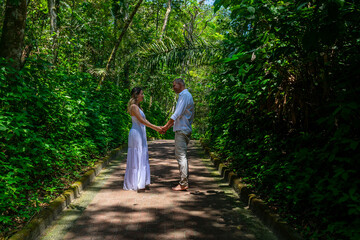 Fototapeta premium man and woman, couple, dressed in white, celebrating together, new year