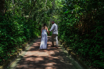 Fototapeta premium man and woman, couple, dressed in white, celebrating together, new year