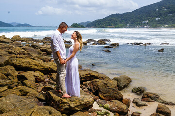 man and woman, couple, dressed in white, celebrating together, new year