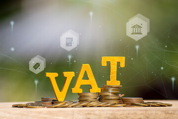 Vat Concept.Word vat with stacked coins there is a notebook calculator on the desk.VAT